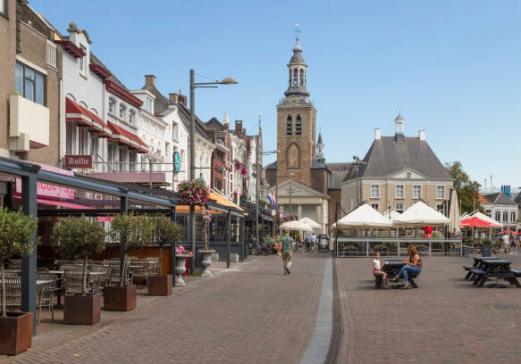 Roosendaal, Netherlands, September 15, 2023; Cozy square with terraces overlooking the St. John's Church in Roosendaal.